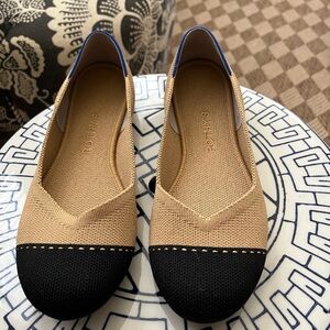 Rothy’s round toe black and tan flats